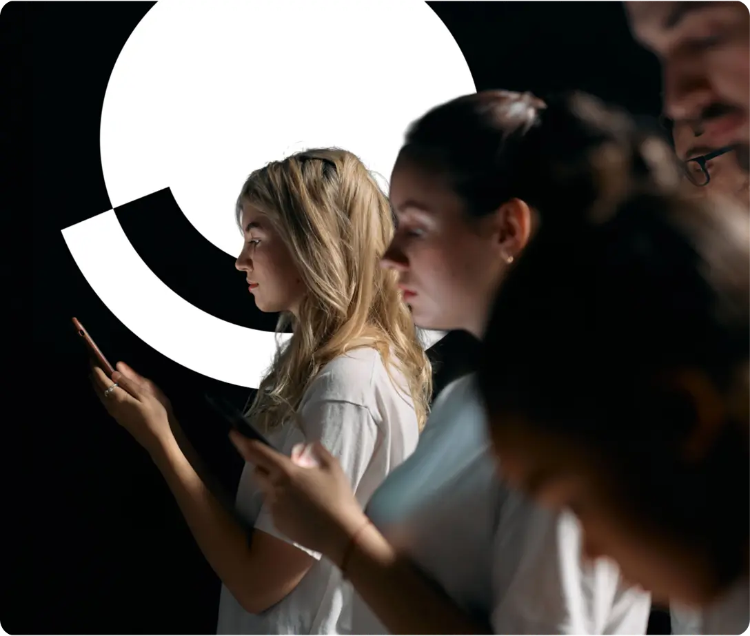 Profiles of people reading their phones in the dark